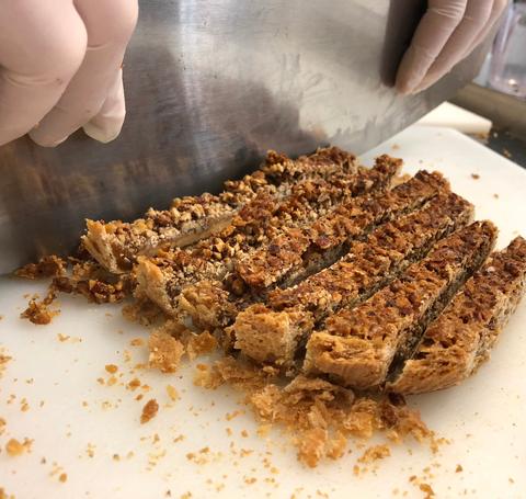 Pastry being cut.